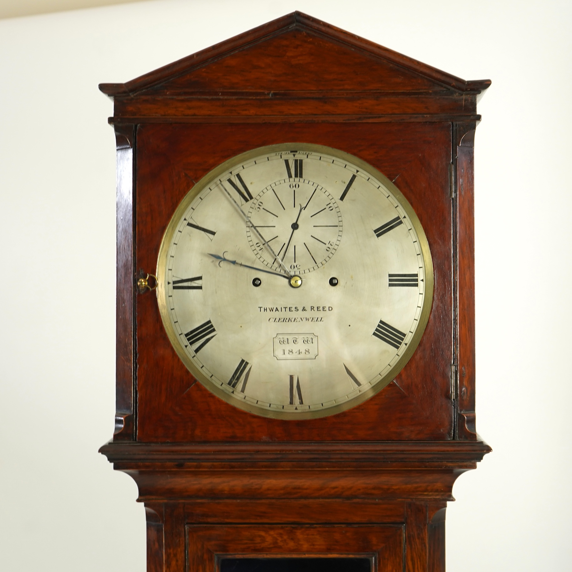 A mid 19th century oak eight day longcase regulator, circular silvered dial signed Thwaites & Reed, Clerkenwell, WTW 1848